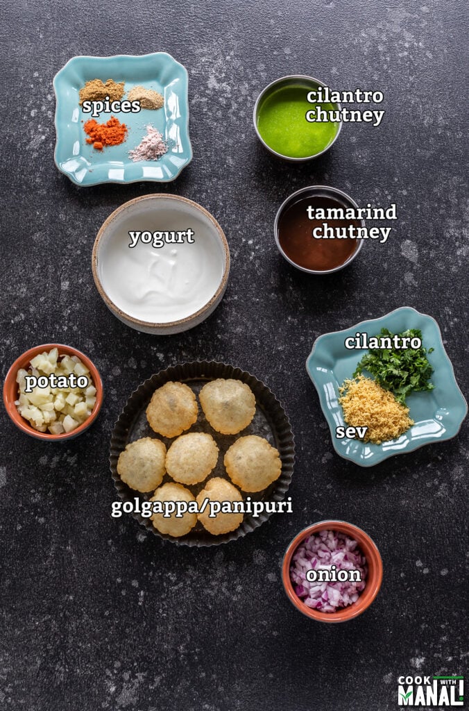 ingredients for dahi puri arranged on a board