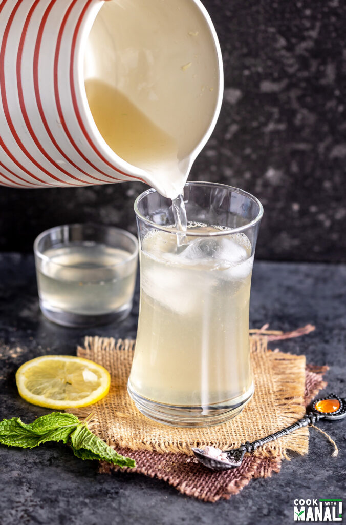 pitcher pouring lemonade into a glass