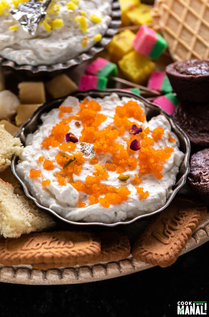 sweet dip topped with motichoor and rose petals