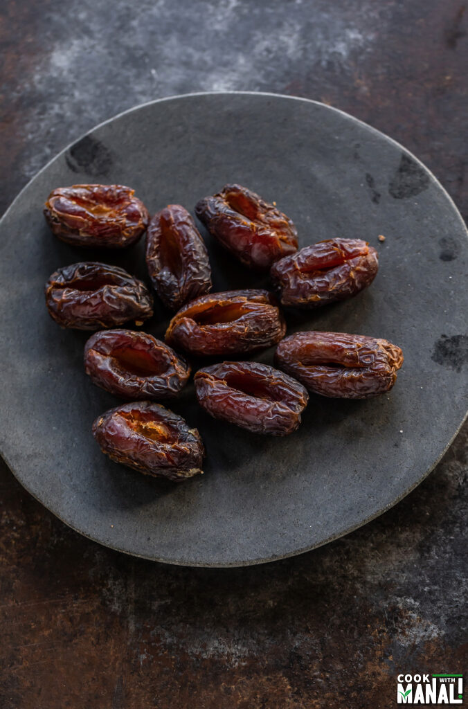 pitted dates arranged on a board
