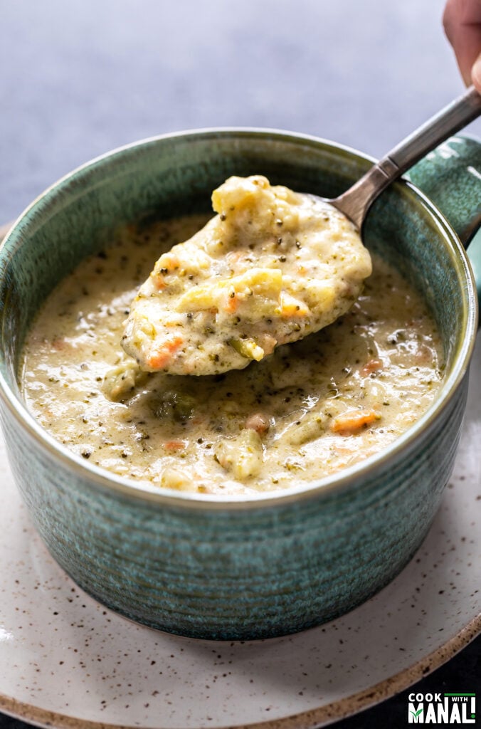 spoon picking up soup from a bowl