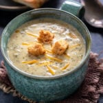 broccoli cheddar soup topped with croutons served in a big bowl