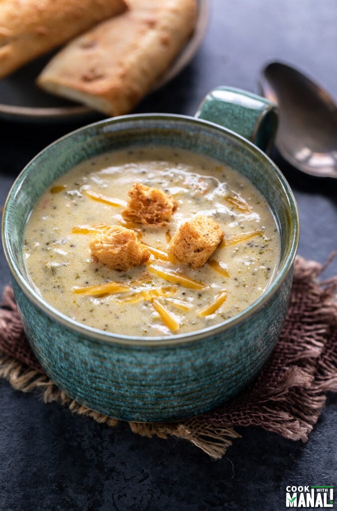 broccoli cheddar soup topped with croutons served in a big bowl