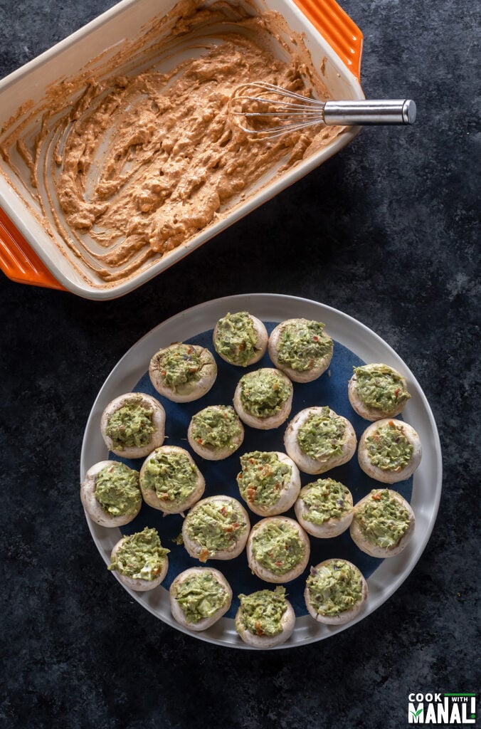 stuffed mushrooms placed in a blue plate