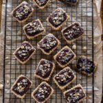 hazelnut shortbread cookies arranged on a wire cooling rack
