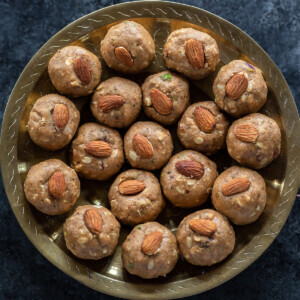 atta pinni garnished with almonds and arranged on a plate