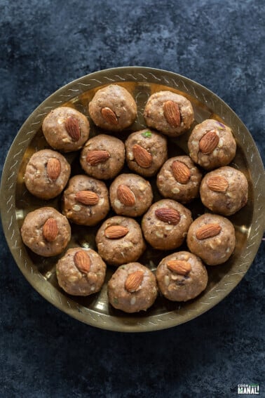 atta pinni garnished with almonds and arranged on a plate