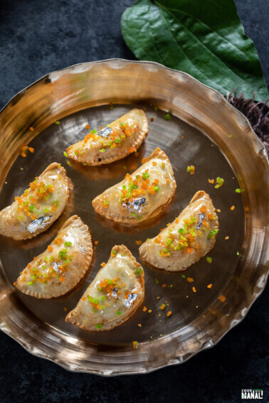 paan gujiya placed on a bronze platter