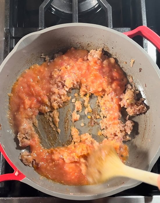 pureed onion tomatoes in pan
