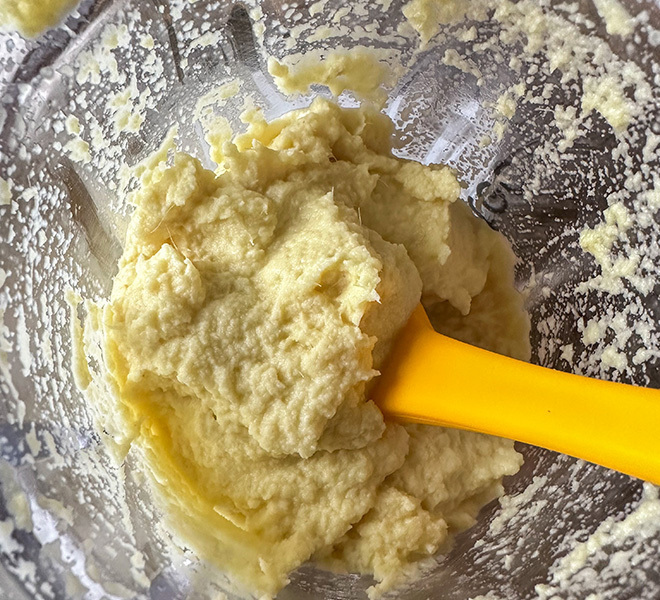 ginger garlic paste with a small yellow spatula on the side