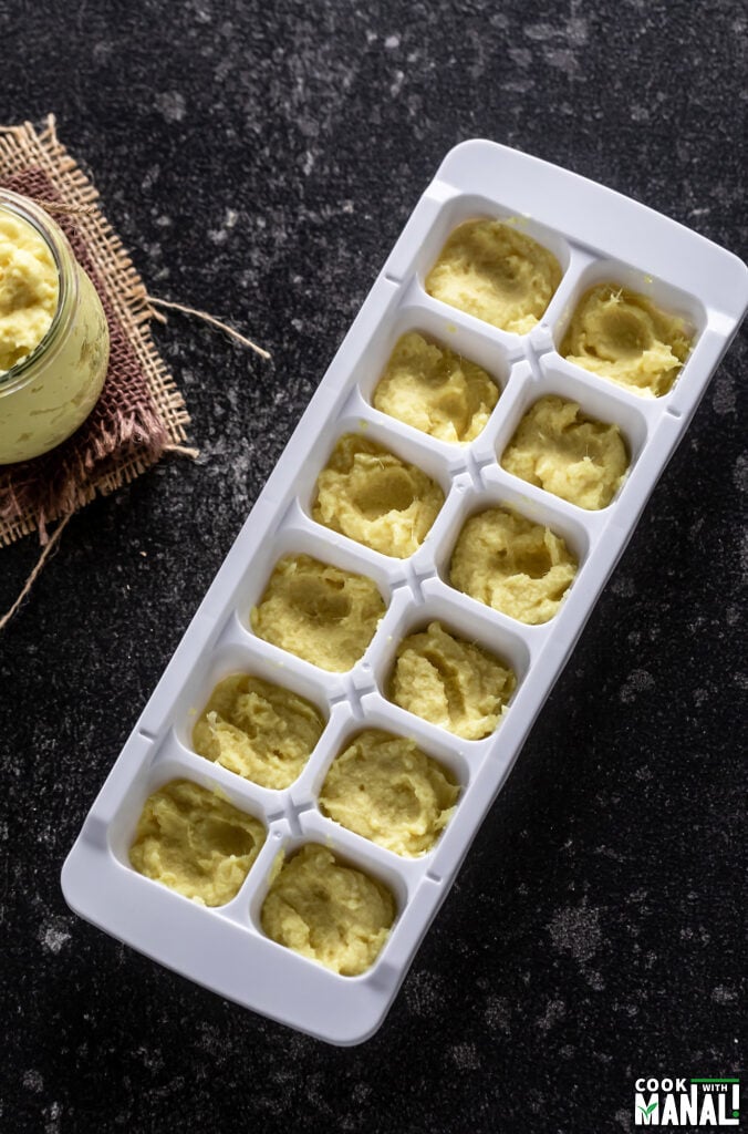 homemade ginger garlic paste measured and placed in individual compartments of an ice cube tray