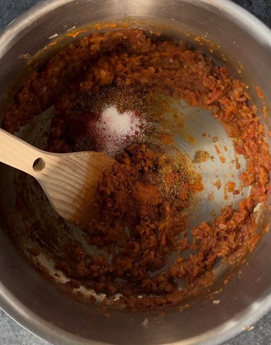 spices and salt added to pureed tomatoes