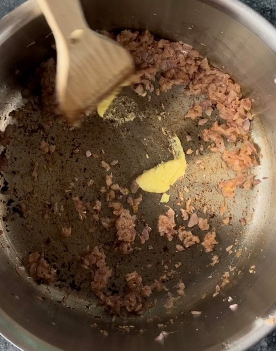 ginger garlic paste with onions in a pot