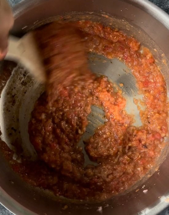pureed tomatoes in a steel pot