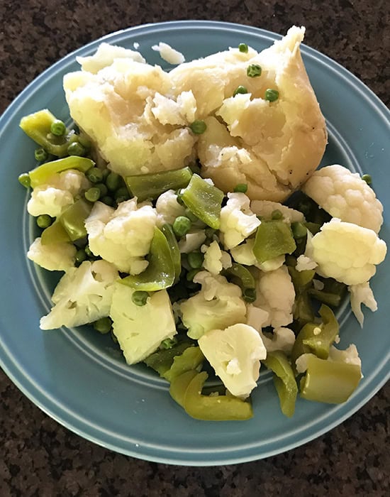 cooked vegetables on a blue plate