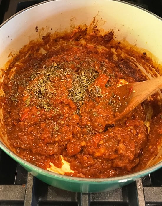 dried fenugreek leaves added to pot of bhaji