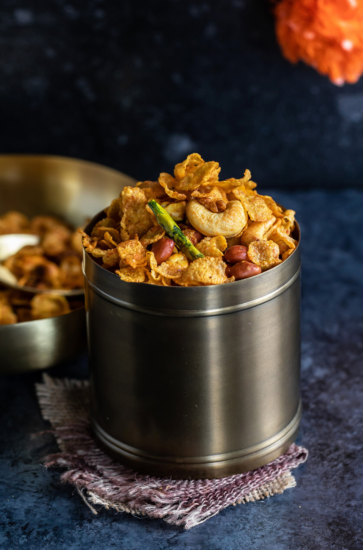 cornflakes chivda served in a copper container