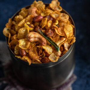 cornflakes chivda served in a copper container