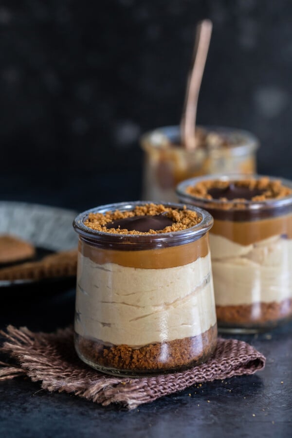 3 biscoff pudding jars arranged in a line, one behind the other