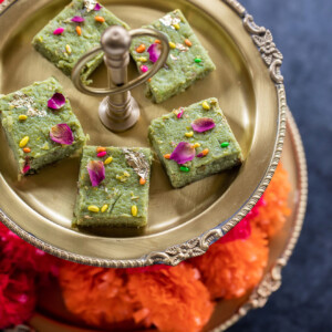 paan kalakand served on a golden two tier serving platter