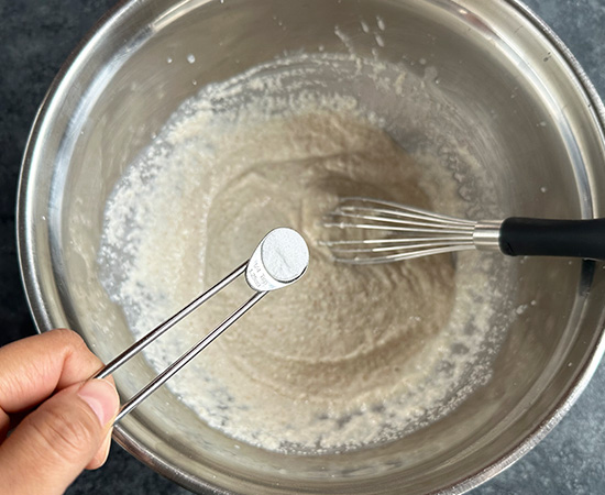 baking soda being added to a bowl