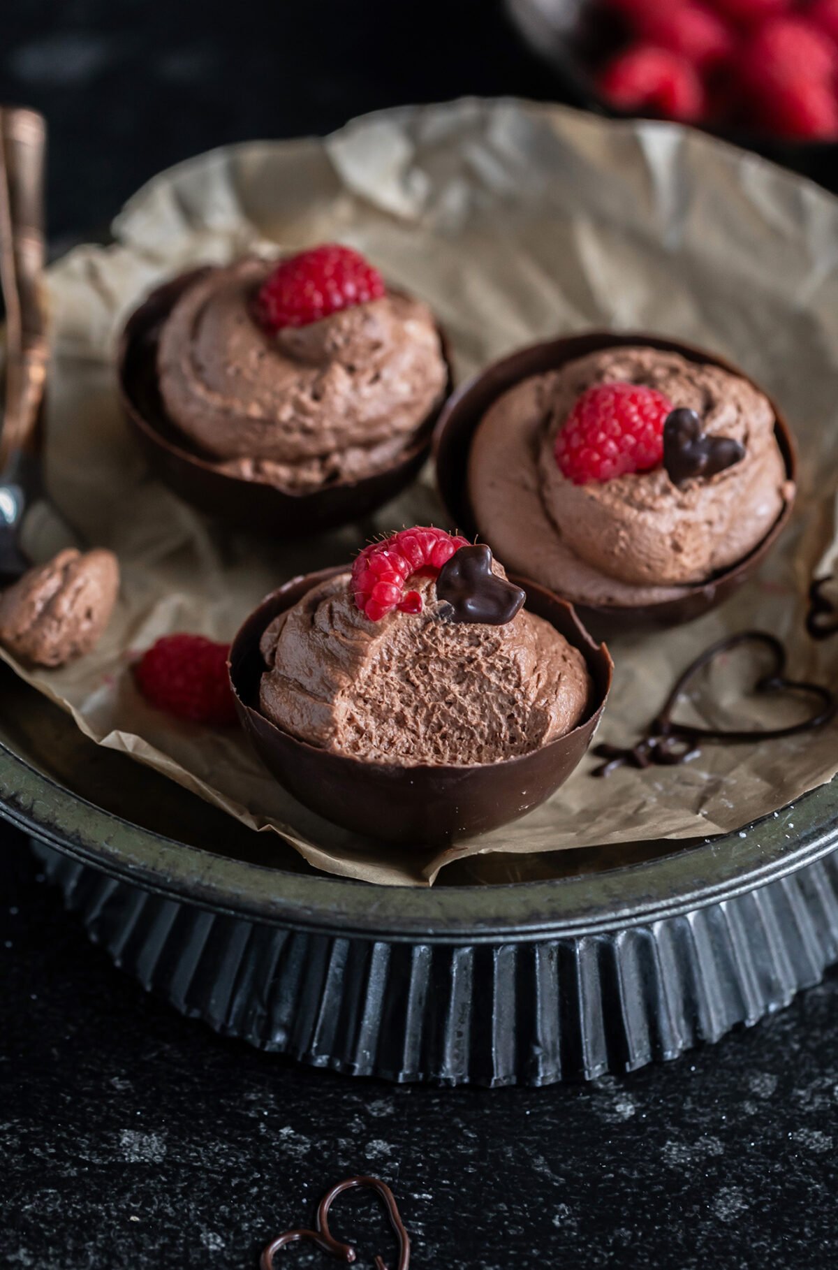 chocolate mousse in chocolate cups, showing the light texture of mousse