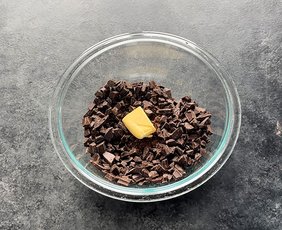 chopped chocolate with butter in a bowl