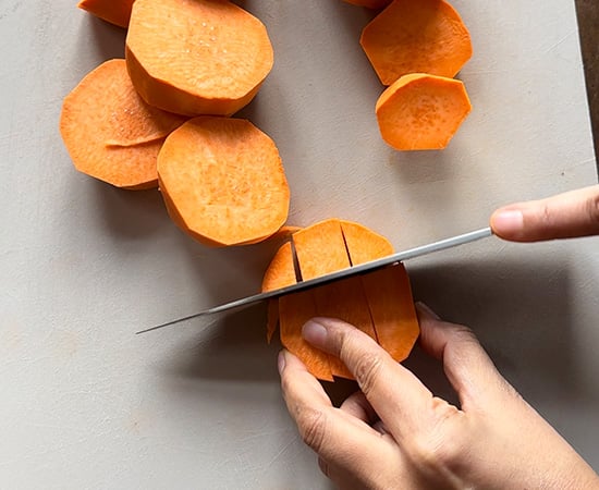 cutting sweet potato in 1/2 inch cubes