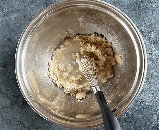 yogurt with semolina in a bowl with a whisk