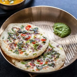 2 rava uttapam served with coconut chutney and bowl of sambar