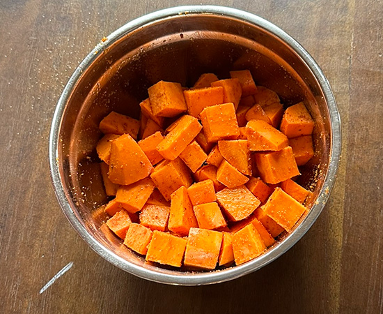 cut sweet potatoes in a bowl