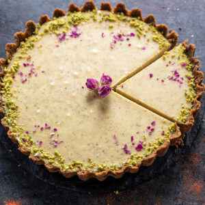 white chocolate thandai tart decorated with dried rose petal