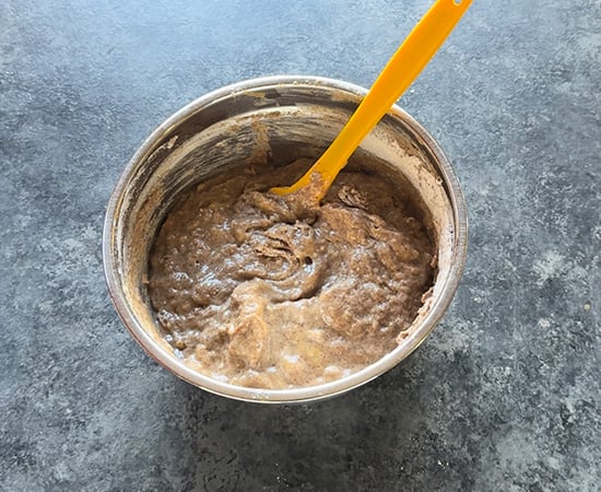 ragi muffin batter in a steel bowl