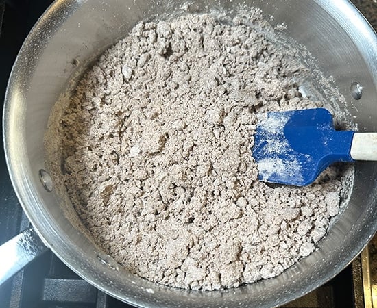 kuttu atta mixed with water in a pan