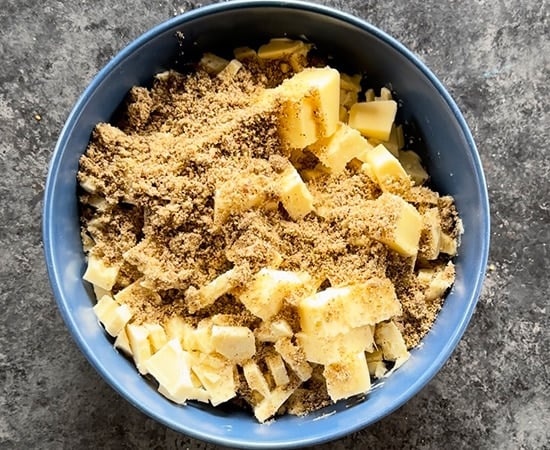 white chocolate with thandai powder and butter in a bowl