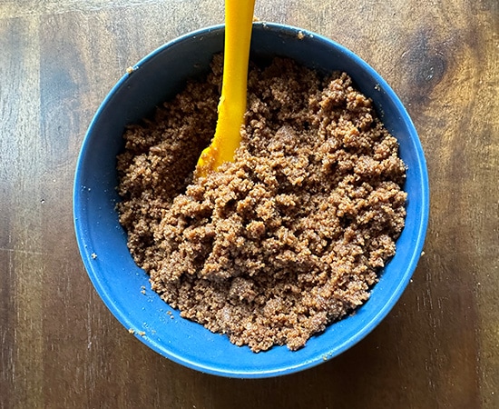 cookie crumbs in a bowl with spatula