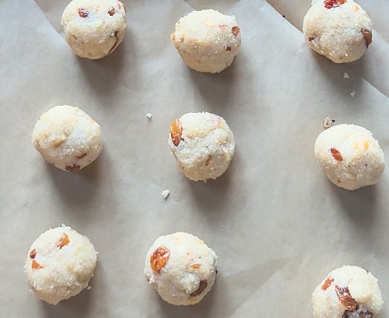 rolled truffles arranged in a pan