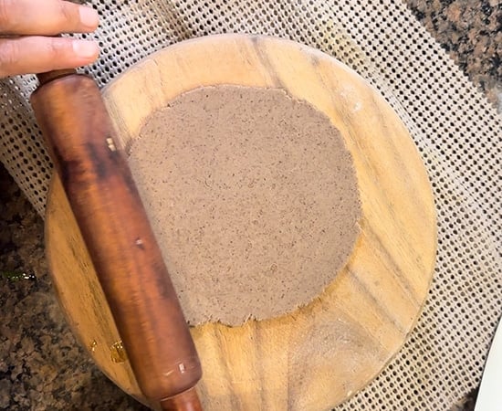 rolled kuttu puri with a rolling pin