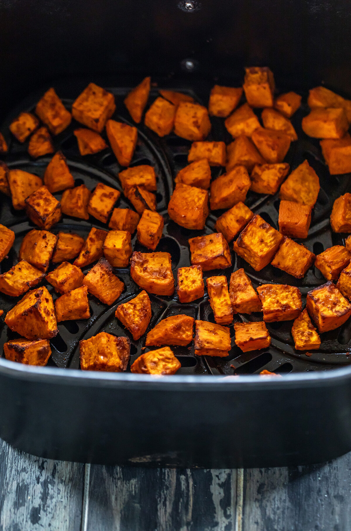 roasted sweet potatoes arranged in air fryer