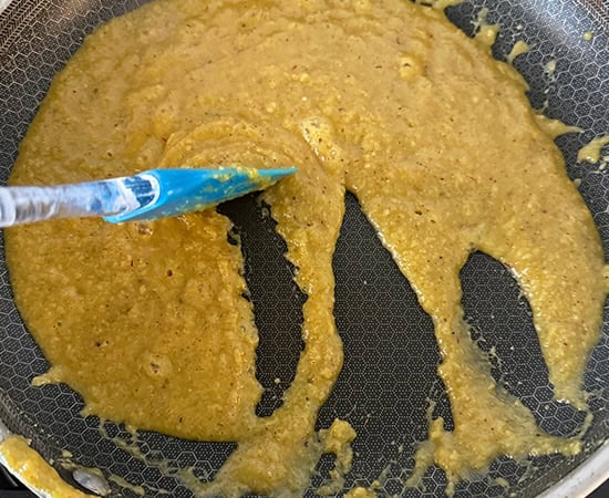 spatula showing how mixture is leaving sides of the pan