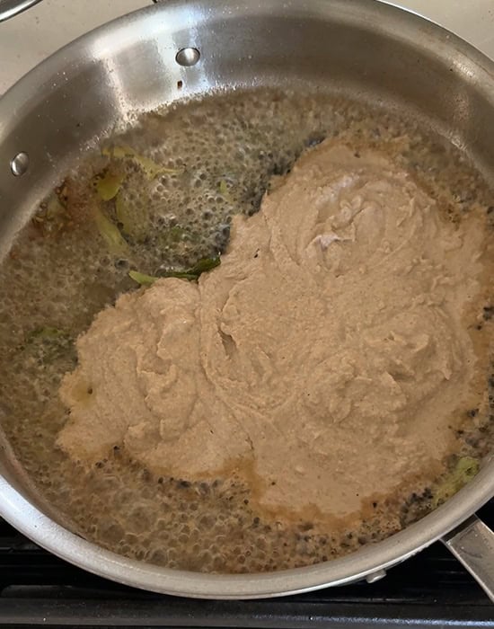 masala paste in a steel pan