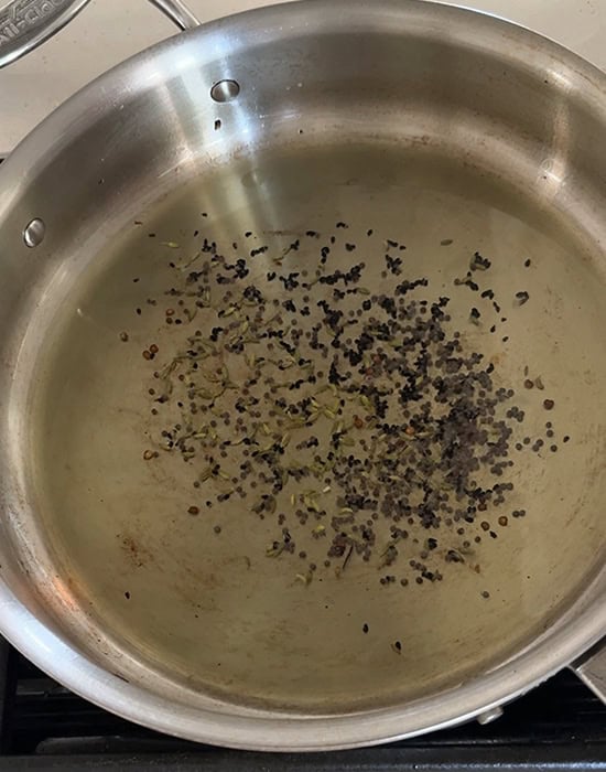 mustard seeds spluttering in oil