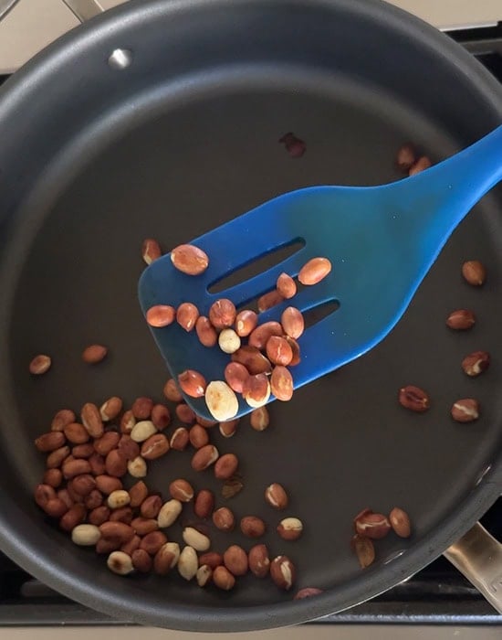 spatula showing the roasted peanuts