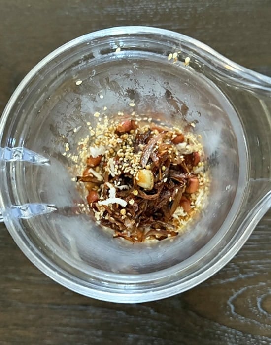 roasted nuts, spices with fried onions in a blender