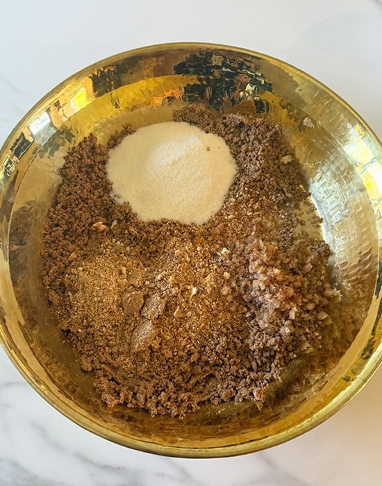 atta with crushed nuts in a plate