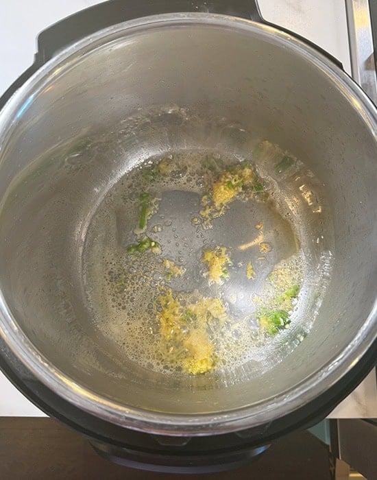 ginger garlic being sauteed in Instant Pot