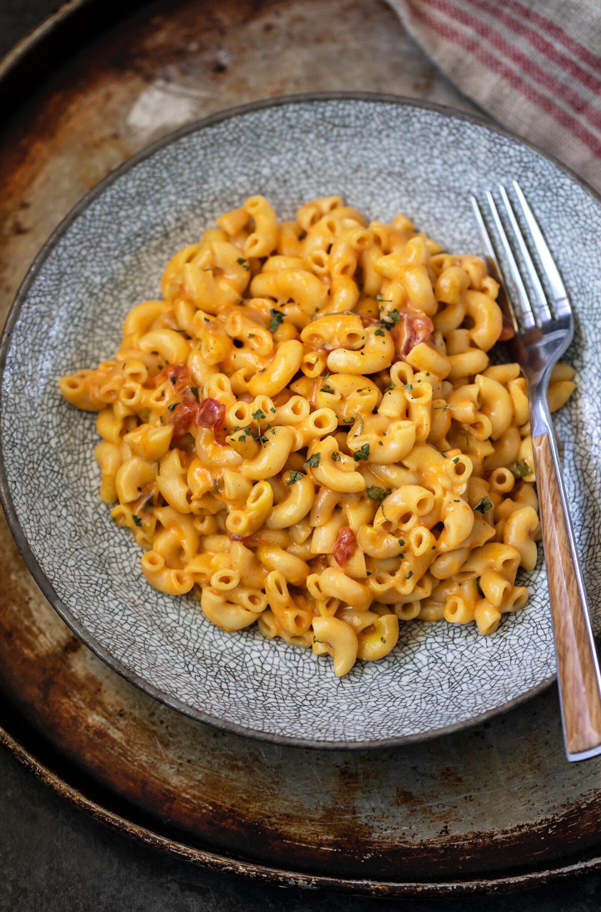 overhead shot of mac and cheese in a bowl with fork placed on the side