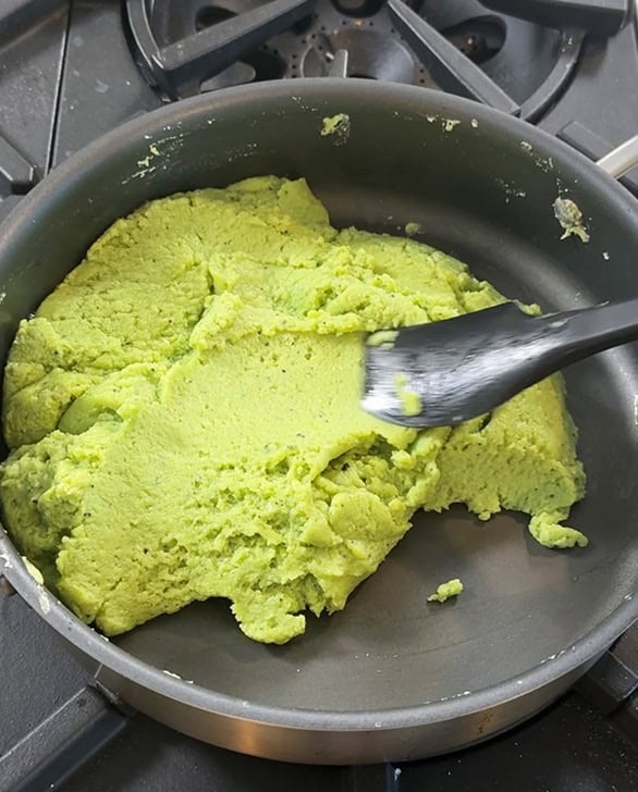 match burfi mixture leaving the sides of the pan