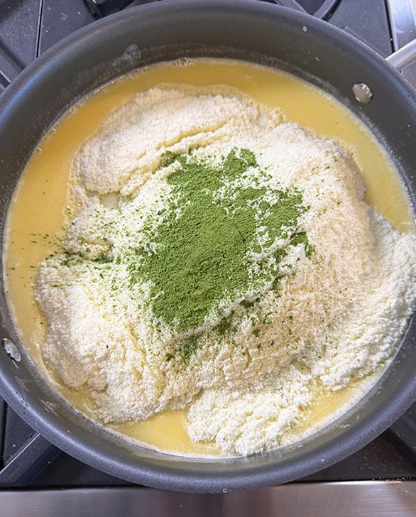 milk powder and matcha powder in a pan