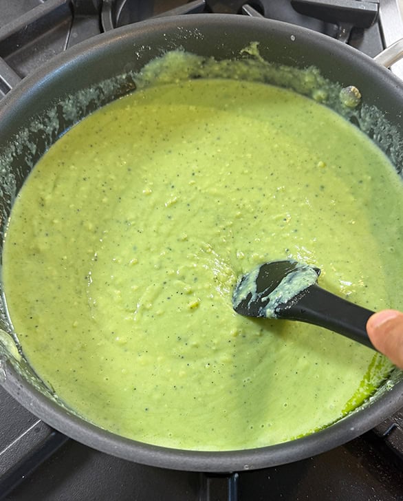 spatula stirring milk powder and matcha mix